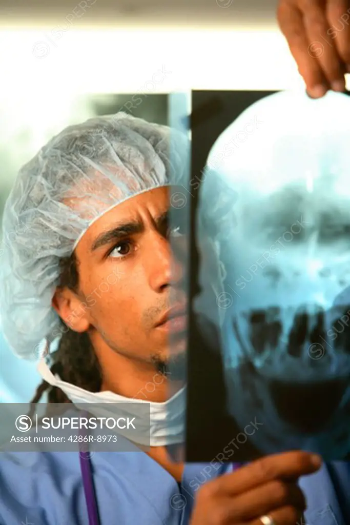 Doctor examines x-rays
