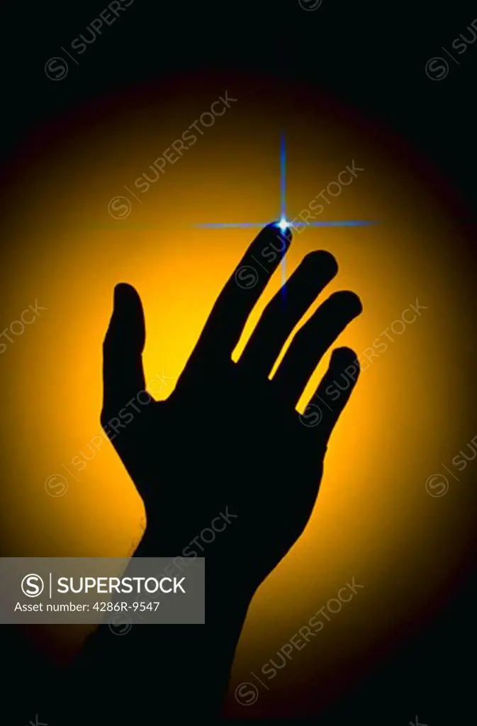 Silhouette of hand with starburst