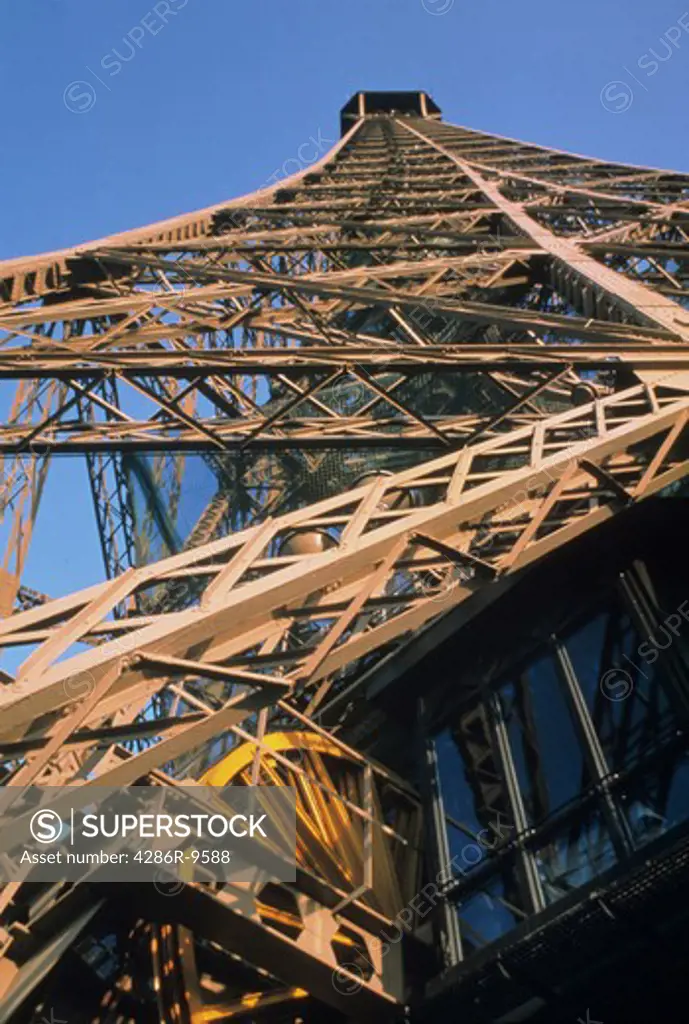Close-up view from below of the Eiffel Tower in Paris, France.