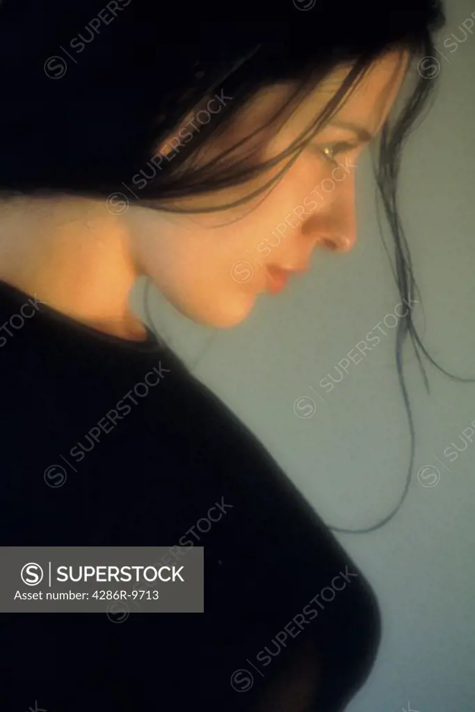 Side portrait of a beautiful, brunette woman.