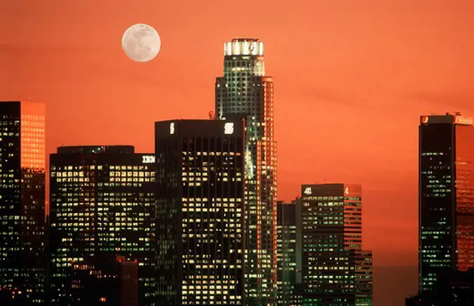 Sunset skies and full moon over downtown Los Angeles office buildings from Elysian Park
