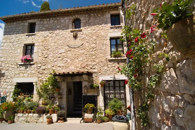 Medieval buildings and flowers in the town of Gourdon in Provence France