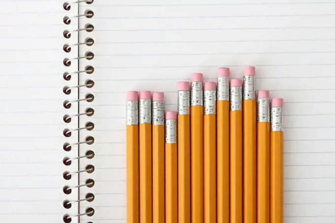 School education still life, pencils on notebook