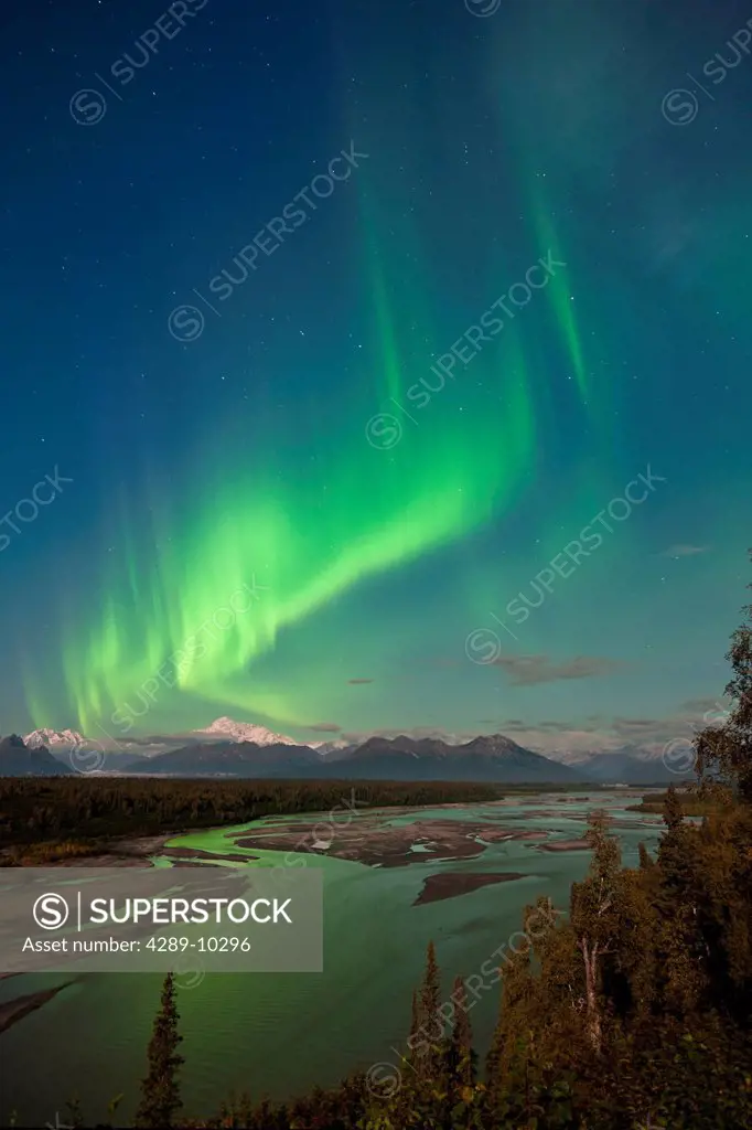 Northern lights above Mount McKinley and the Chulitna River during a full moon, seen from the Parks Highway overlook, Denali State Park, Alaska, Autum...
