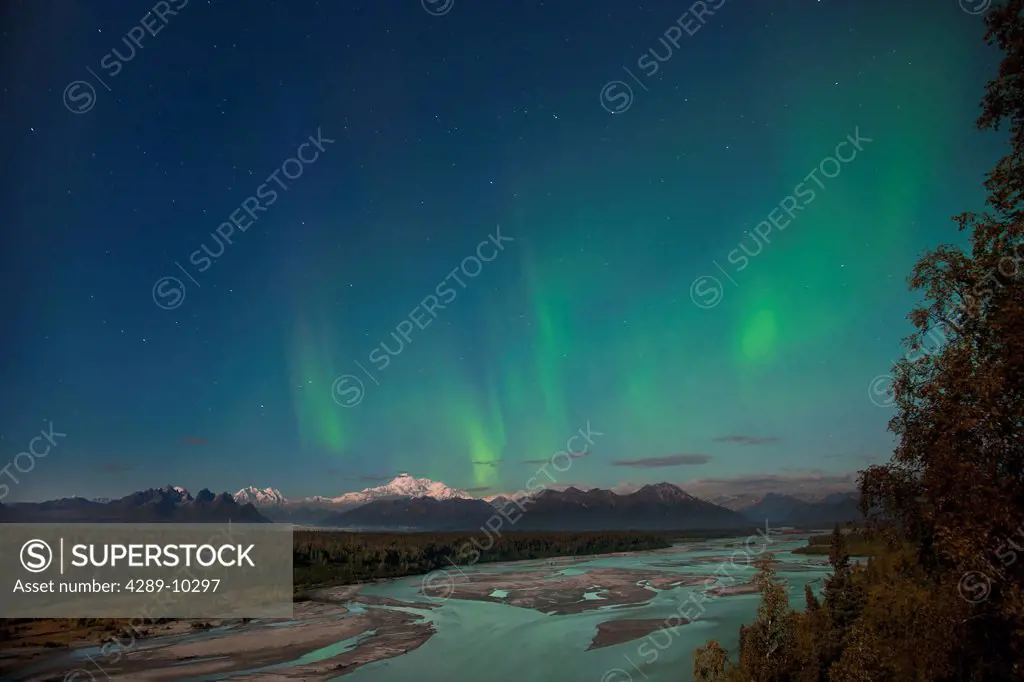 Northern lights above Mount McKinley and the Chulitna River during a full moon, seen from the Parks Highway overlook, Denali State Park, Alaska, Autum...