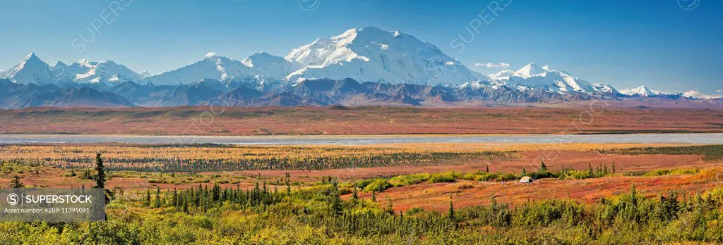 Panoramic view f a tent camp and Mt McKinley during the autumn in Denali National Park, Alaska.