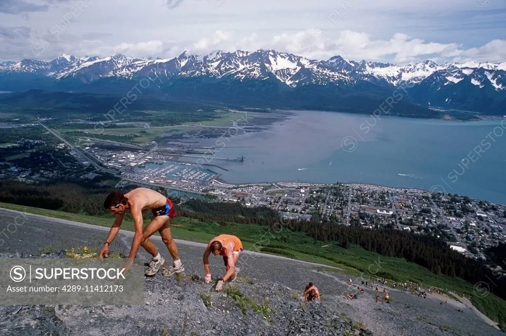 Male Runners Ascend Mount Marathon During Race On Rocky Slope Seward Alaska