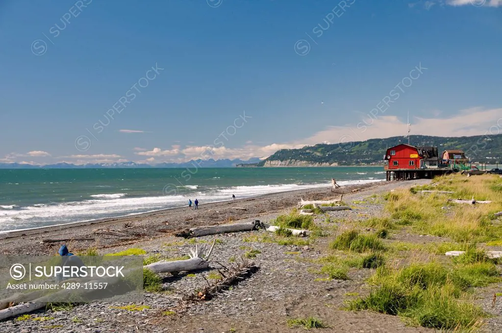 Scenic view of Kachemak Bay and businesses along the Homer boardwalk and beach, Kenai Peninsula, Southcentral Alaska, Summer