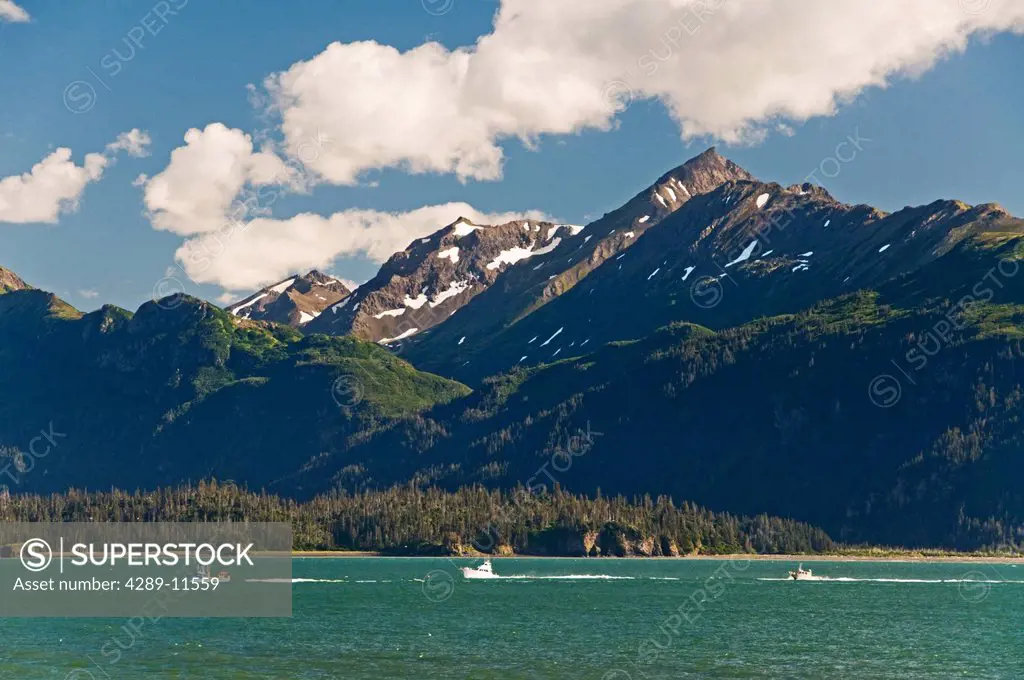 Sport fishing charter boats in Kachemak Bay with the Kenai Mountains and Sadie Peak in the background, Kachemak Bay State Marine Park, Southcentral Al...