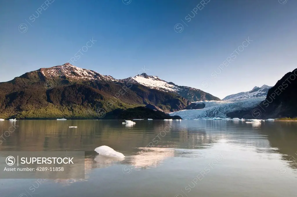 Scenic view of icebergs floating in Mendenhall Lake with Mendenhall Glacier in the background, Tongass National Forest near Juneau, Southeast Alaska, ...