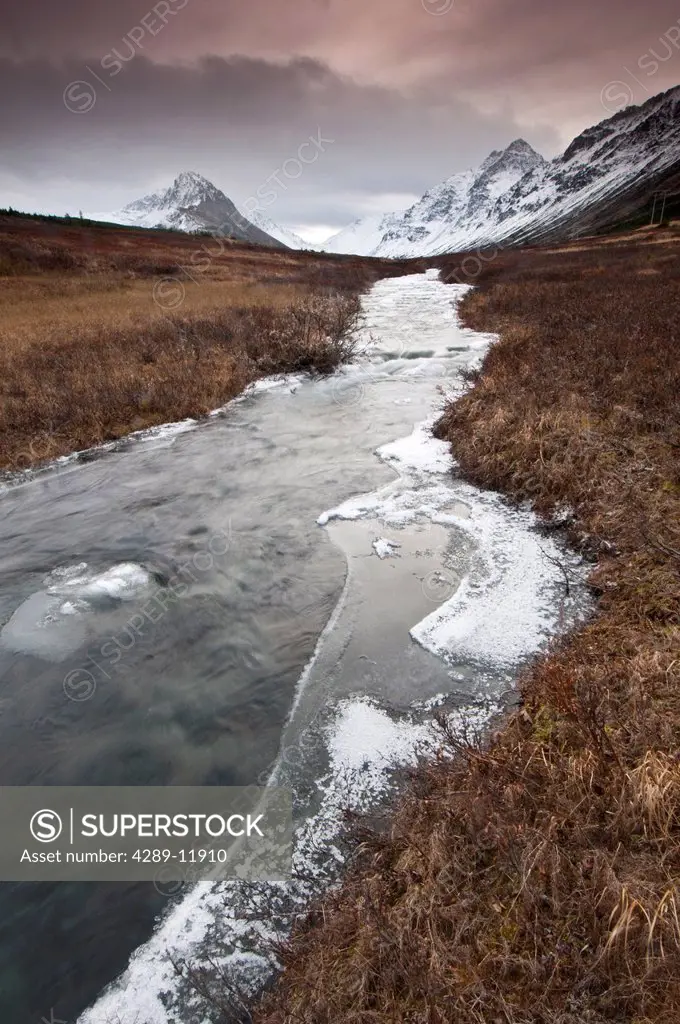 Ice forms along the banks of the South Fork of Campbell Creek in Chugach State Park, Southcentral Alaska, late Autumn