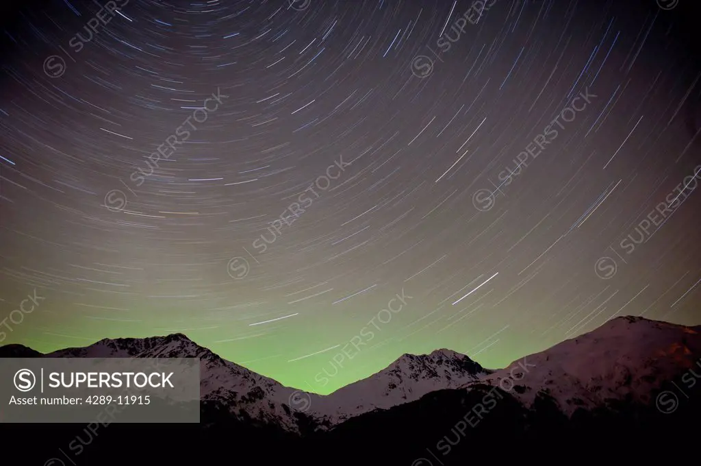 time elapse view of the night sky and star trails over the Chugach Mountains, Portage Valley, Southcentral Alaska, Winter