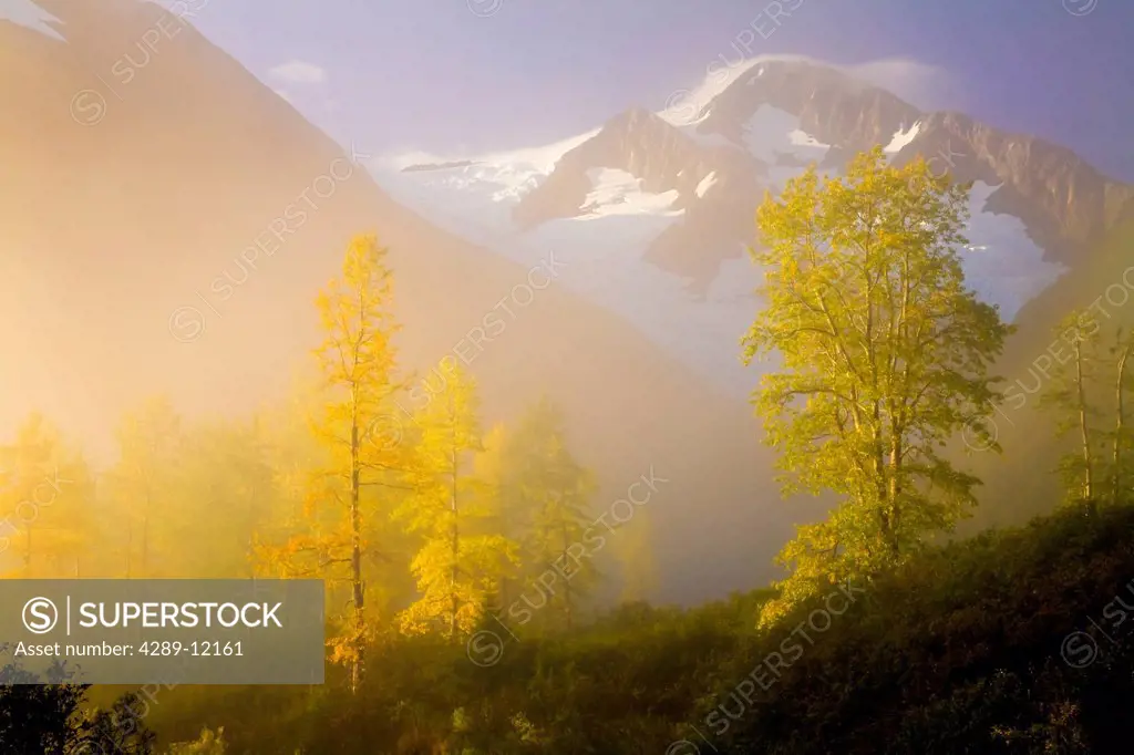 Scenic view of fog lifting in front of Byron Peak and Glacier, Portage Valley, Chugach National Forest, Southcentral Alaska, Autumn, HDR