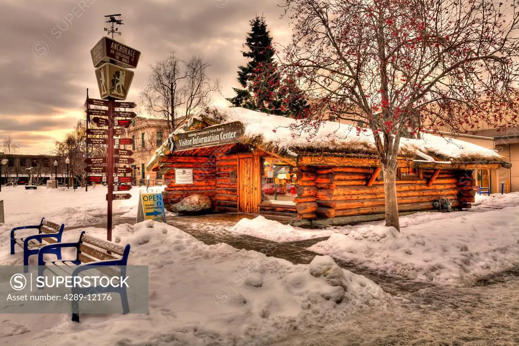 Log Cabin Visitor Center and milepost sign covered in snow, Downtown Anchorage, Southcentral Alaska, Winter, HDR