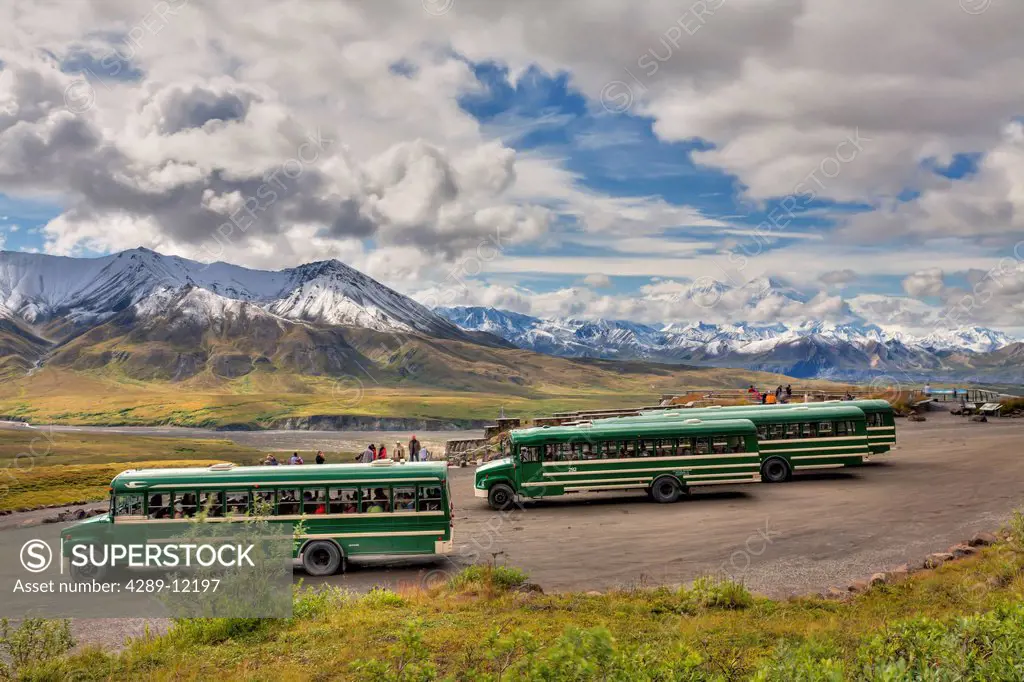 Scenic view of Mt. McKinley and tourist shuttle buses parked at Eielson Visitor Center in Denali National Park and Preserve, Interior Alaska, Summer, ...
