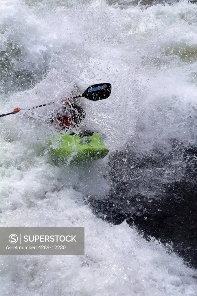 Man kayaking in whitewater action USA