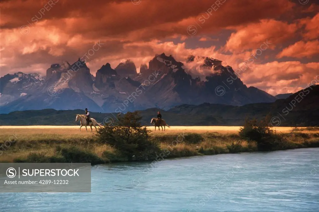People horseback riding in Torres Del Paine National Park Patagonia Chile