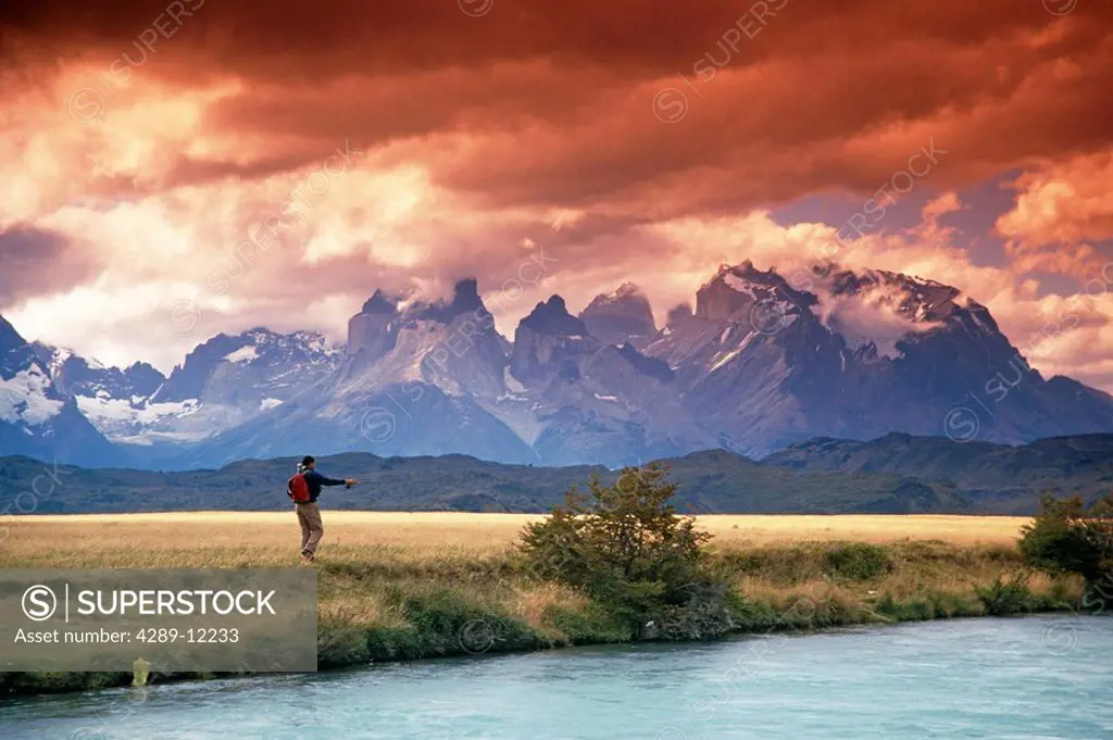 Man flyfishing on river Torres del Paine National Park Patagonia Chile