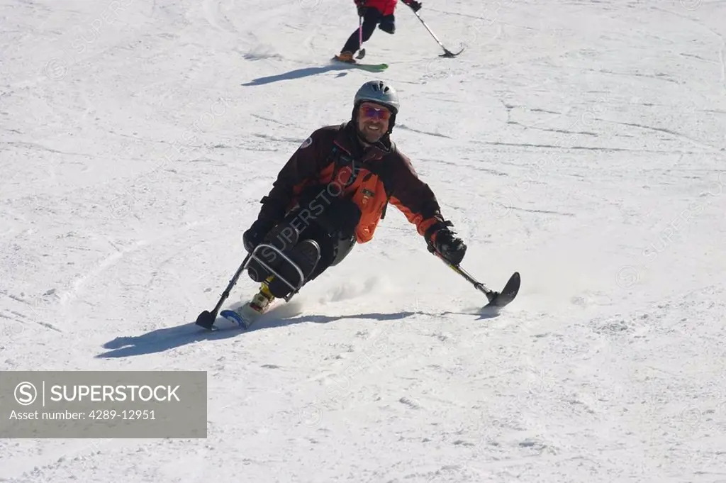 Pro Ski Instructor of America Demo Team skis on his mono_ski at Telluride Colorado