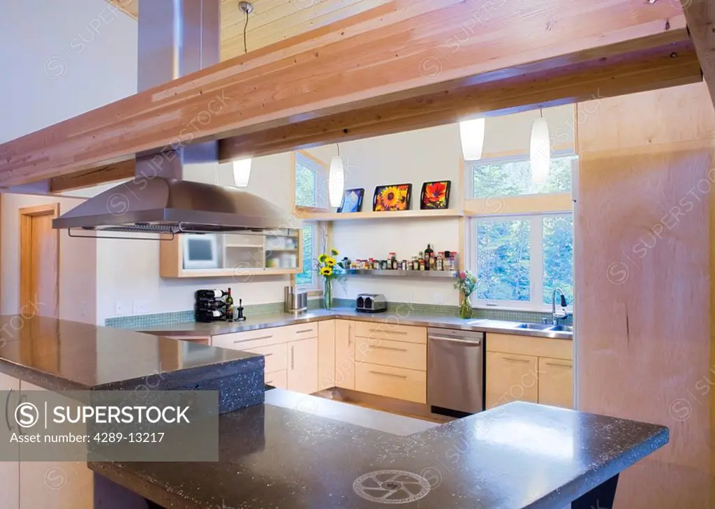 Kitchen view of a contemporary residence with woodwork, Anchorage Alaska.