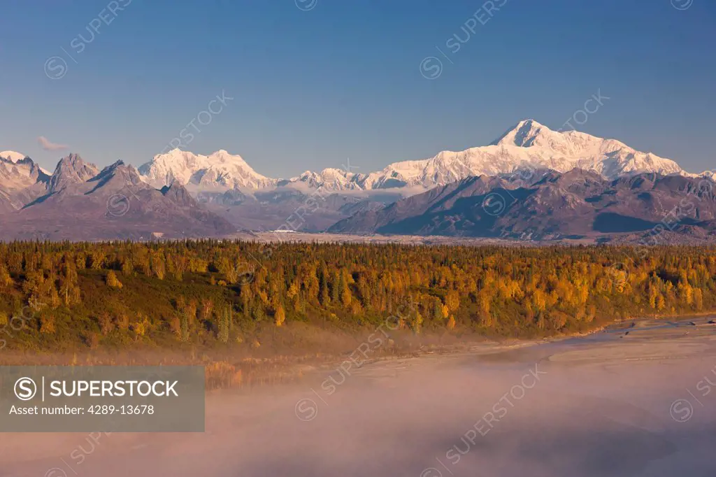 Scenic morning view of fog in the Chulitna River valley with Mt. McKinley in the background, Denali State Park, Southcentral Alaska, Autumn