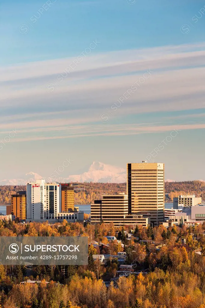 Aerial view of downtown Anchorage in autumn with Denali in the background, Southcentral Alaska, USA