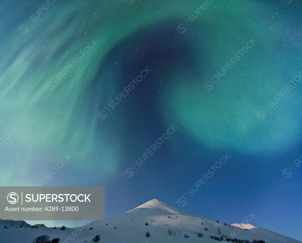 Composite, Northern Lights aurora borealis the Talkeetna Mountains in Hatcher Pass on a clear cold winter night, Southcentral Alaska