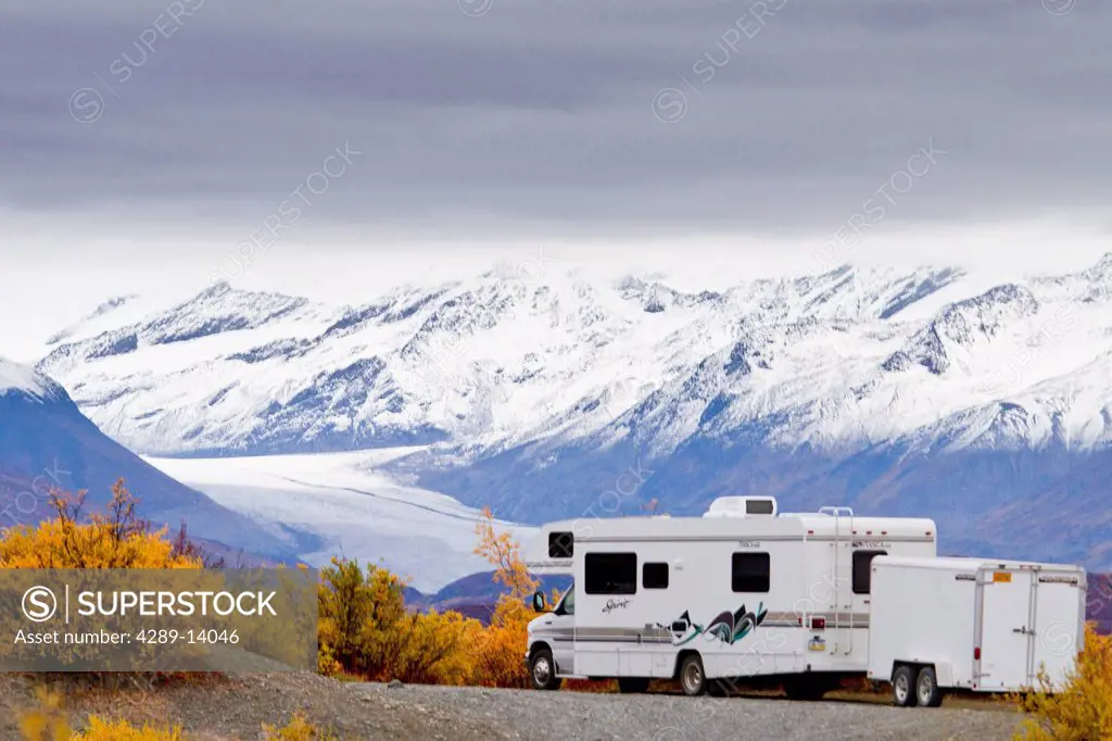 Motorhome parked in front of Maclaren River Lodge with Maclaren Glacier in background, Denali Highway, Southcentral Alaska, Autumn
