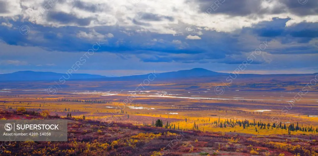 Overview of the Maclaren River Valley with storm clouds and fall colors, Southcentral Alaska, HDR