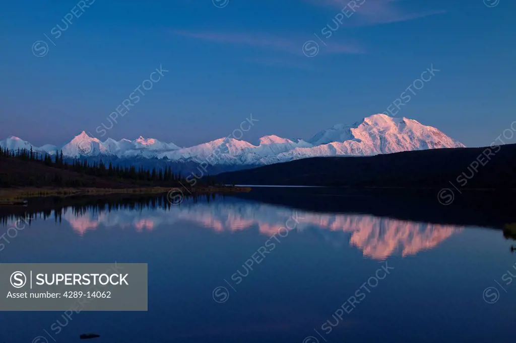 Sunset view of Mt. McKinley and Mt. Deception reflecting in Wonder Lake, Interior Alaska, Autumn