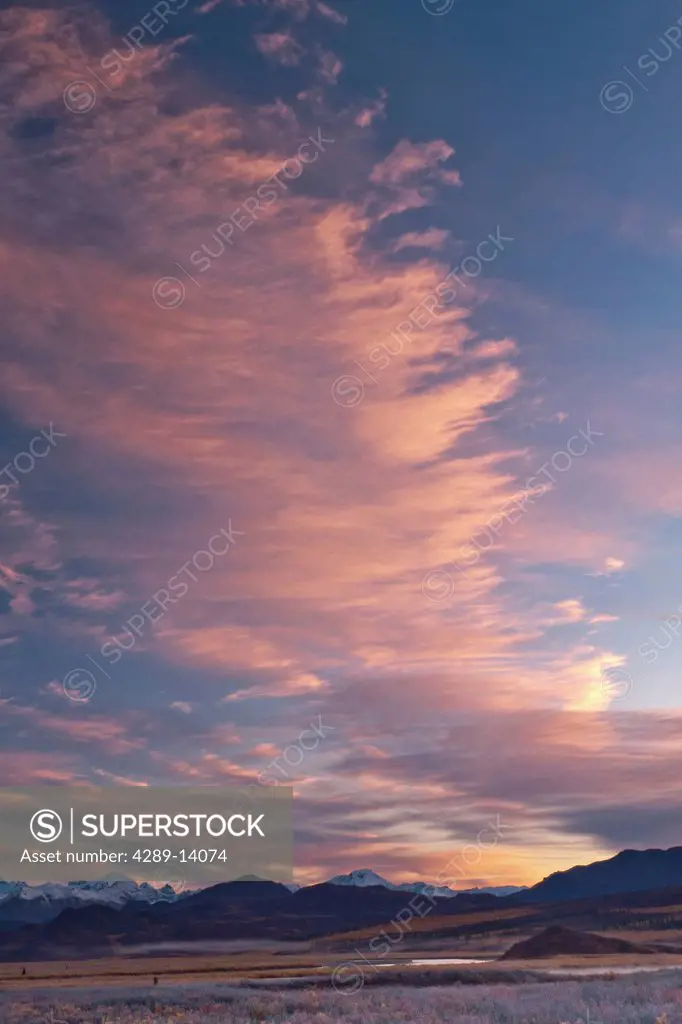 View of a cloud formation at sunrise over the Maclaren River along the Denali Highway, Southcentral Alaska, Autumn