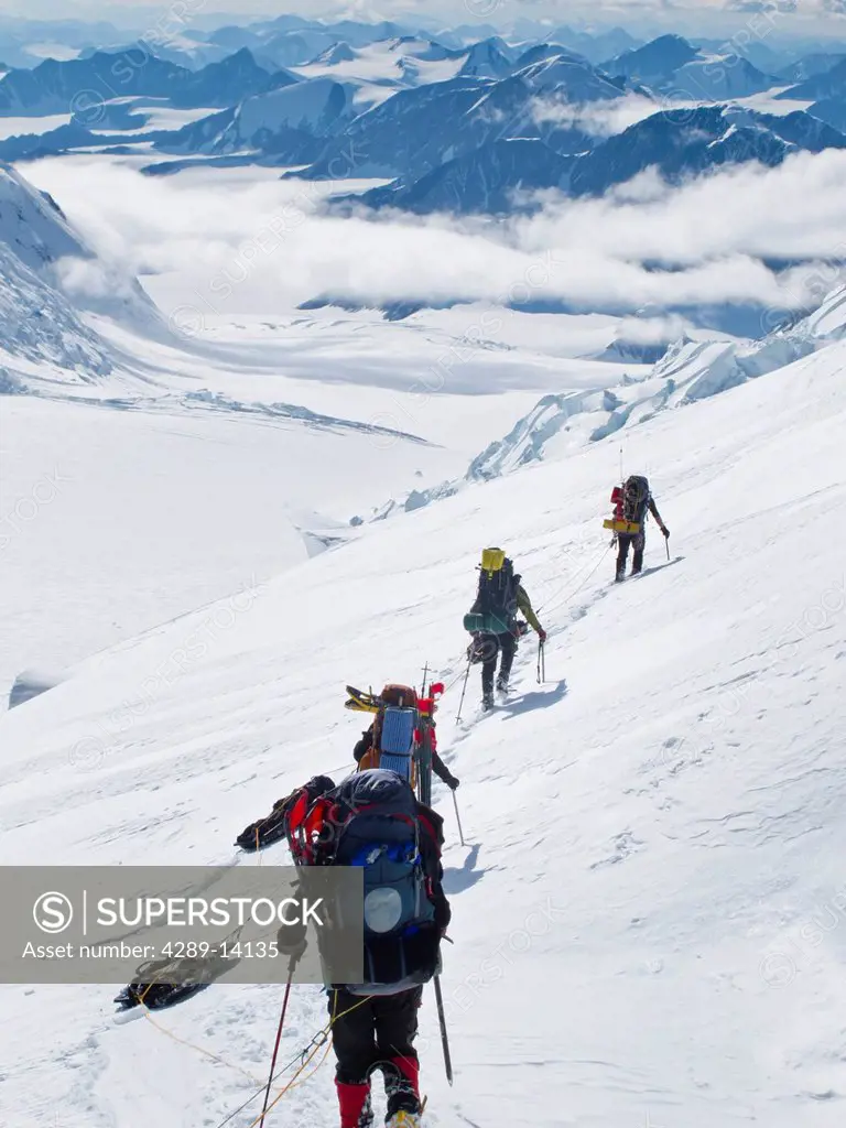 Mountaineer group descends into the MacCarthy Gap on the King Trench route, Mt. Logan, Kluane National Park, Yukon Territory, Canada, Summer