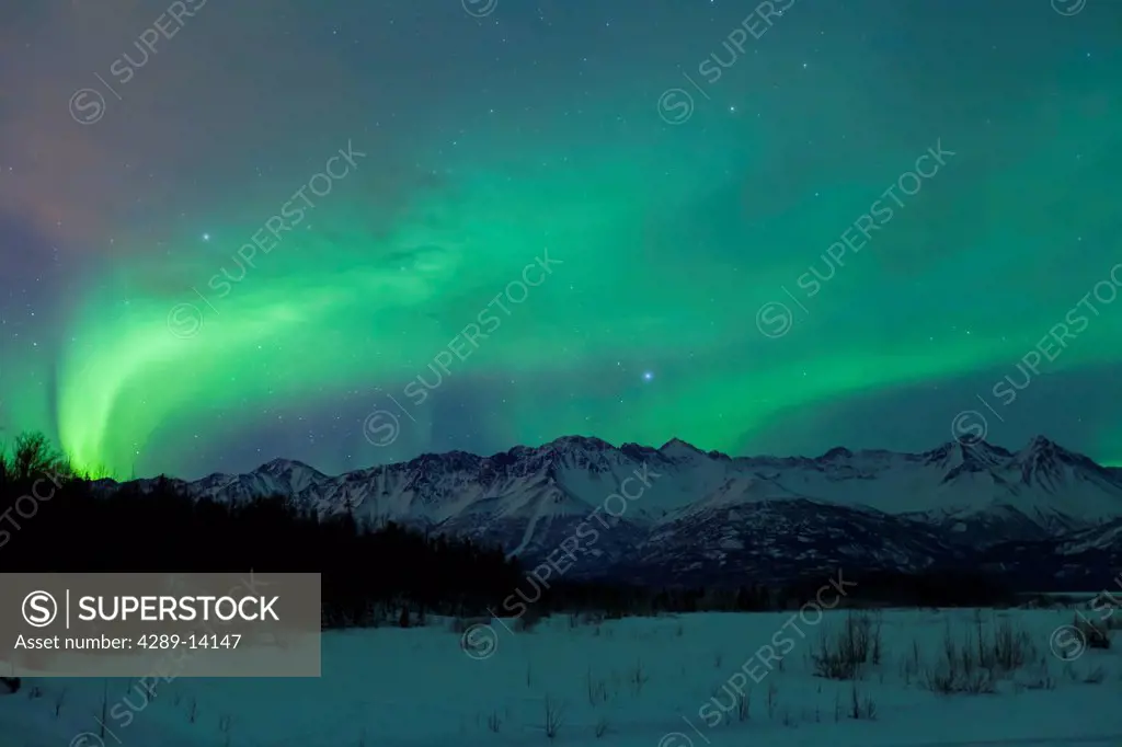 Aurora Borealis Northern Lights over the Knik River Valley and the Chugach Mountains, Southcentral, Alaska, Winter