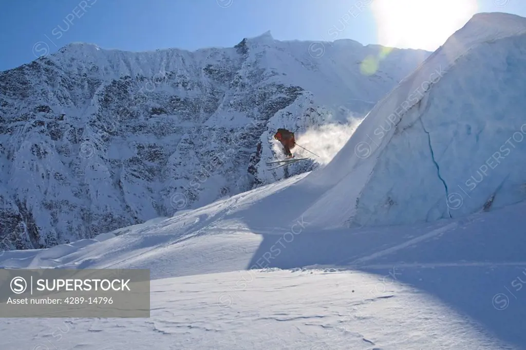 Skier making a jump on Solidarity Mountain in Wrangell_St. Elias National Park during Spring in Alaska