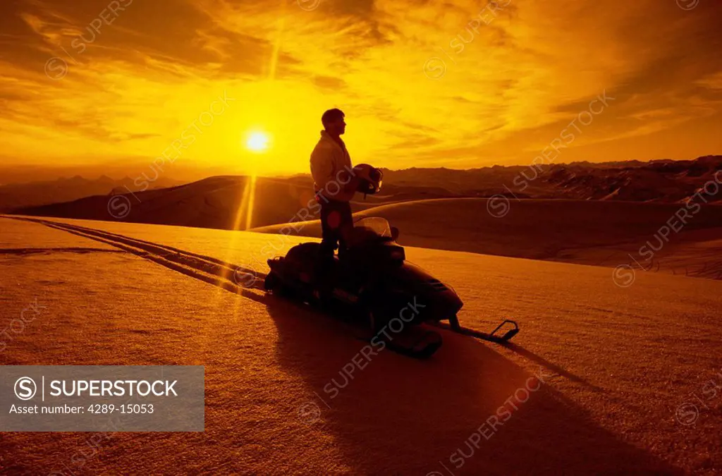 Snowmobiling @ sunset Talkeetna Mtns SC AK winter scenic