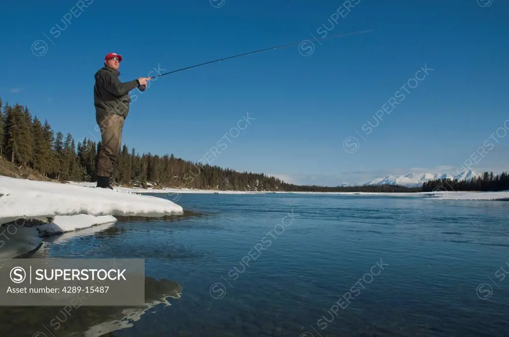 Fisherman Center Pin Fishing the Kenai River during Spring in Alaska