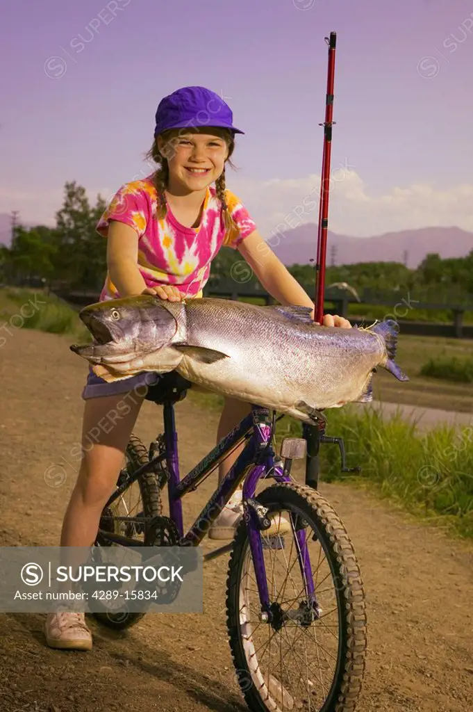 Young Girl on Bike Holds King Salmon Digital SC AK Summer Ship Creek