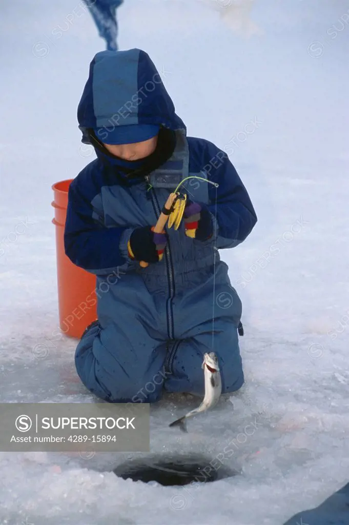Young Boy Catches Trout While Ice Fishing SC AK Winter Anchorage Jewel Lake