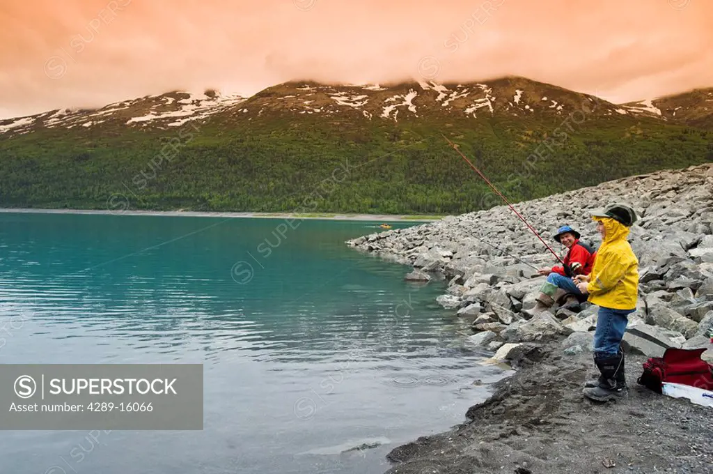 Father and son fishing at Eklutna Lake in Southcentral Alaska during Summer