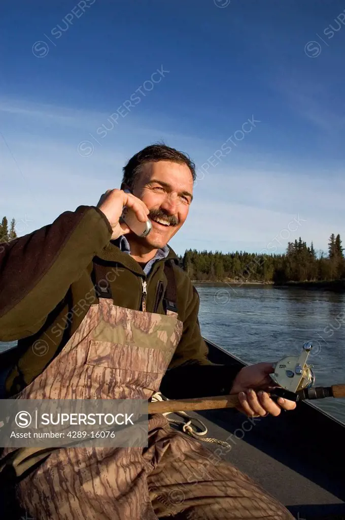 Man On Cellphone While Drift Fishing Kasilof River for King Salmon KP AK Spring