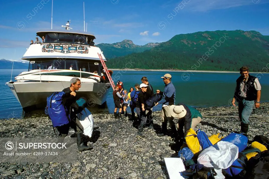 Tourists Unloading Gear From Day Boat Glacier Bay NP SE AK