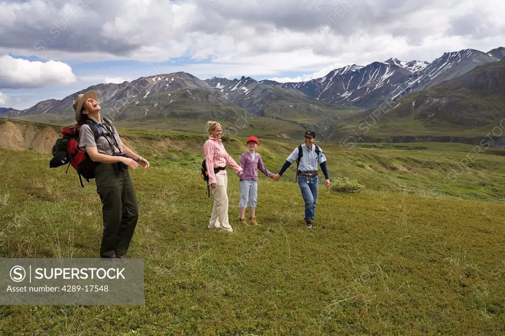 Female National Park Interpretive Ranger leades group on a *discovery hike* in the Eielson area Denali National Park Alaska