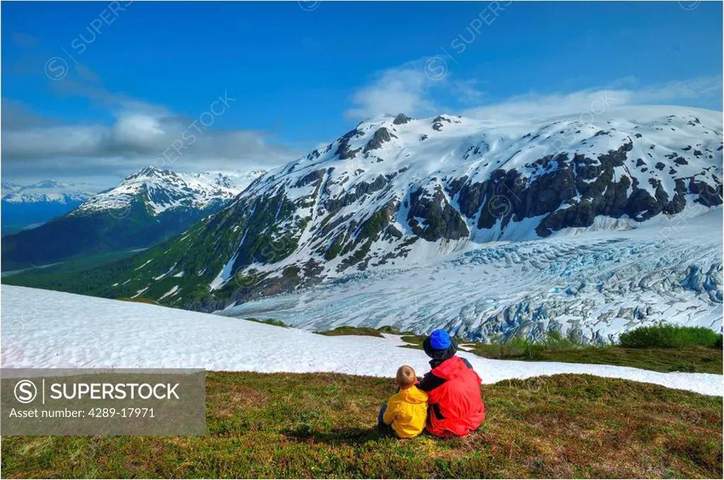 Father and son on the Harding Ice Field Trail overlooking Exit Glacier in Kenai Fiords National Park, Alaska
