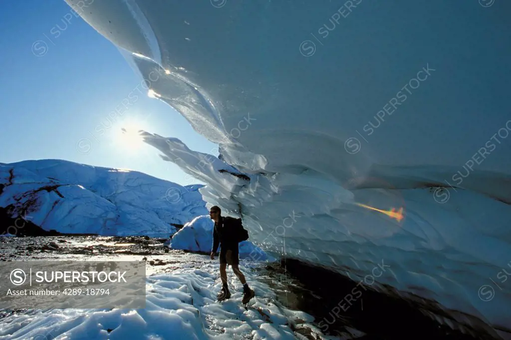 Man Hikes in Crampons @ Matanuska Glacier SC AK Summer