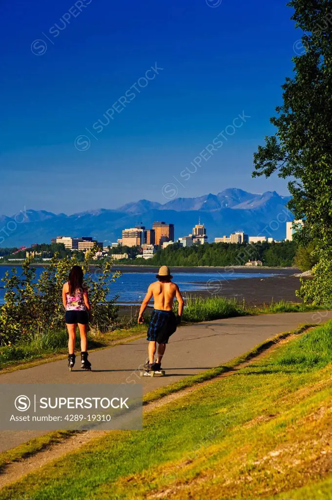 People rollerblade on the Tony Knowels Coastal Trail, Anchorage, Southcentral Alaska, Summer