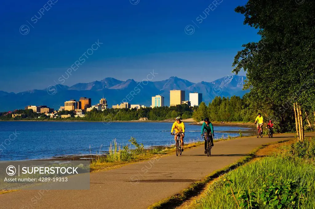 Bicyclists riding on the Tony Knowles Coastal Trail, Anchorage, Southcentral Alaska, Summer