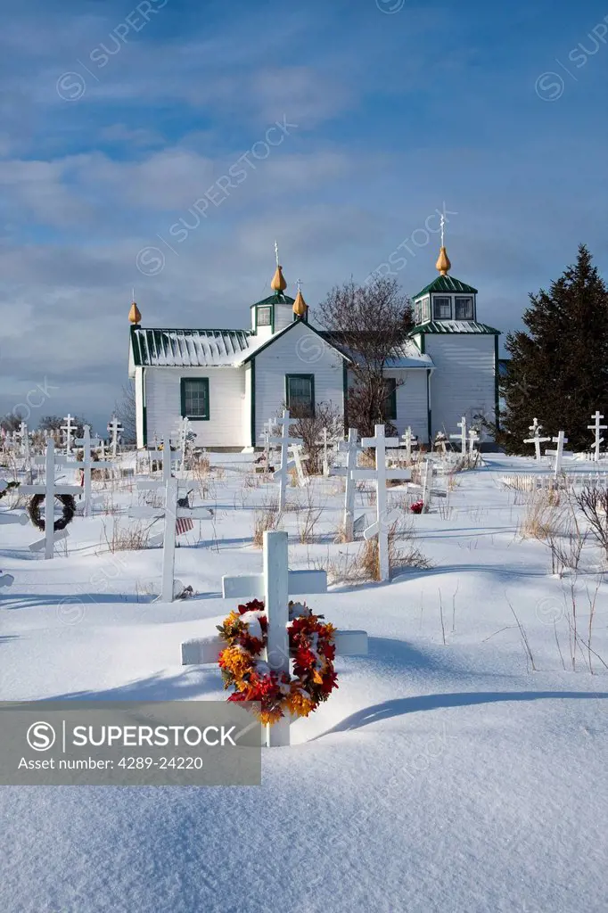 Our Lord Russian Orthodox Church in Ninilchik with the church cemetery in the foreground, Kenai Peninsula, Southcentral Alaska, Winter/n