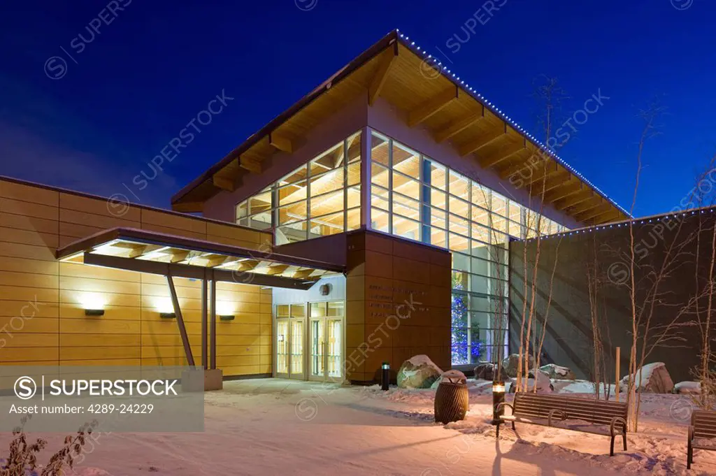 Twilight view of the Morris Thompson Cultural & Visitors Center during Winter in Fairbanks, Alaska