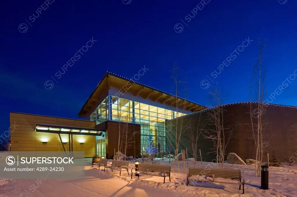 Twilight view of the Morris Thompson Cultural & Visitors Center during Winter in Fairbanks, Alaska