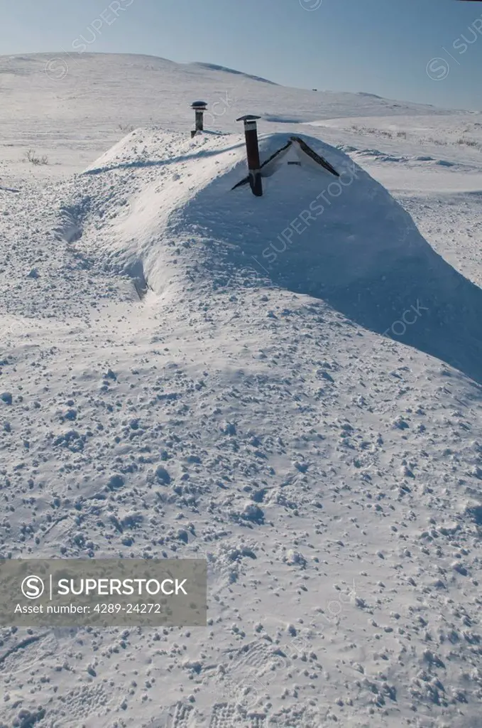 View of a cabin burried and *snowed_in* near Nome, Alaska